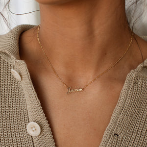 Model wearing gold Nayru Name Necklace