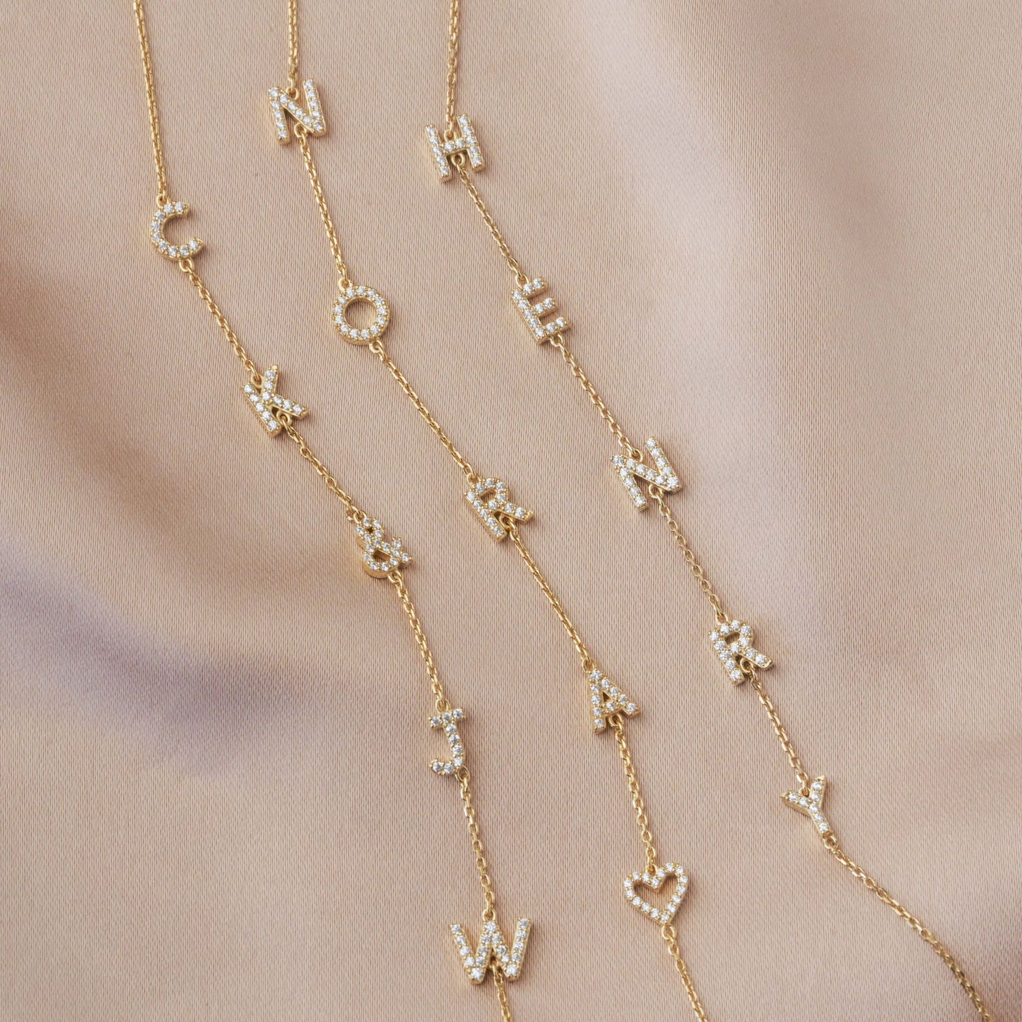 Examples of Bianca Pave Name Bracelets with heart symbols