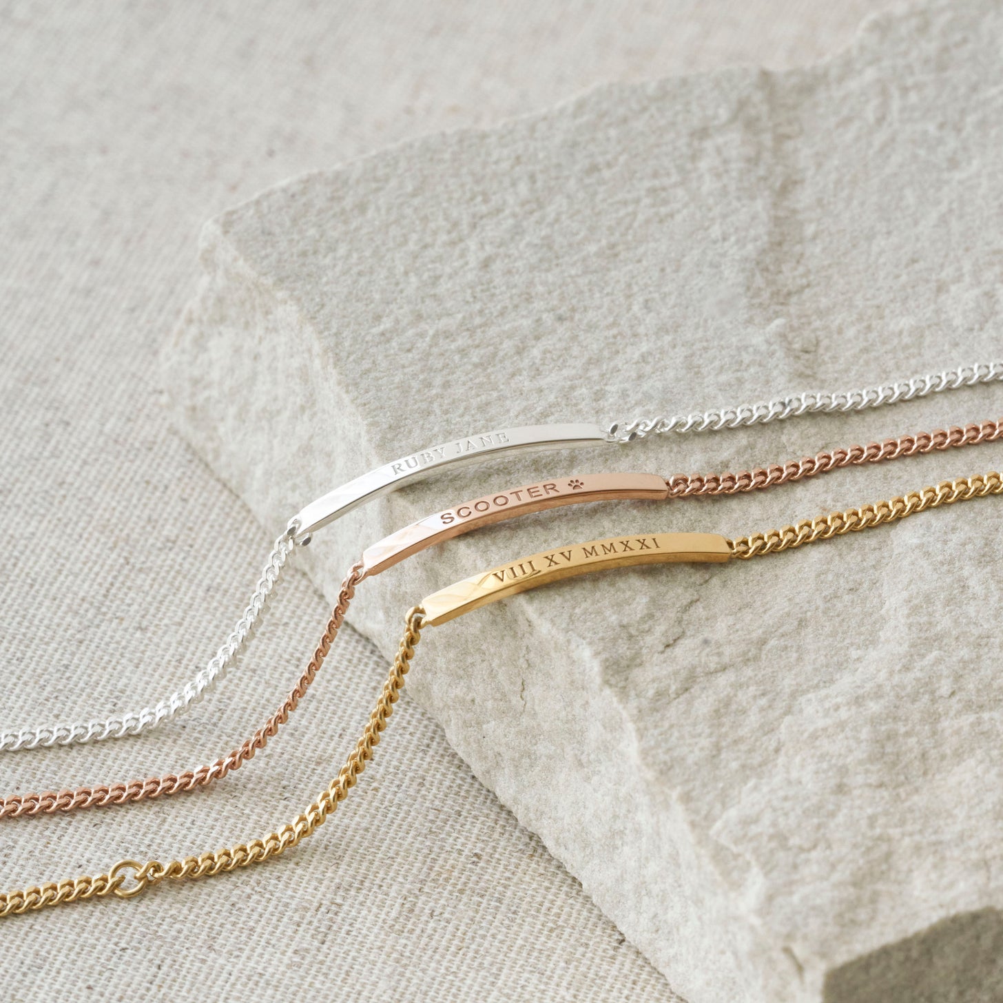 Gold, silver, and rose gold Dana Engraved Bar Bracelets with curb chain