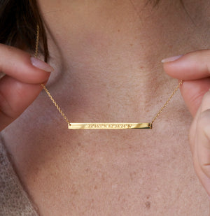 Personalized bar necklace with engraved coordinates, names, and messages