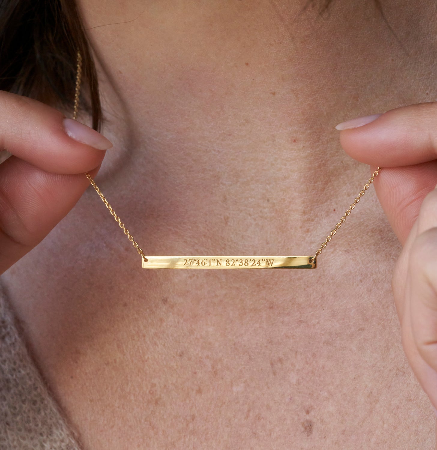 Personalized bar necklace with engraved coordinates, names, and messages
