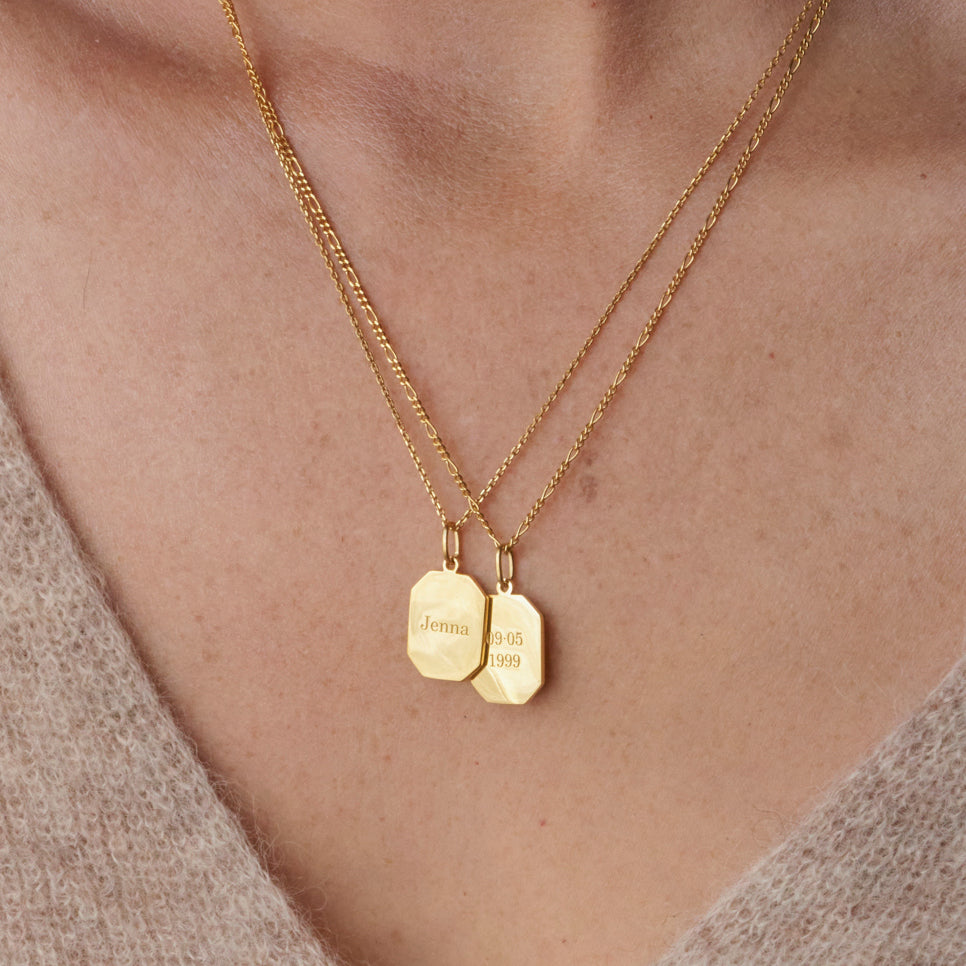 Custom engraved names, dates, initials, and affirmations on our customer-favorite Elena dog tag pendant necklace in gold