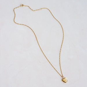 Engraved name on a custom heart pendant with figaro chain necklae