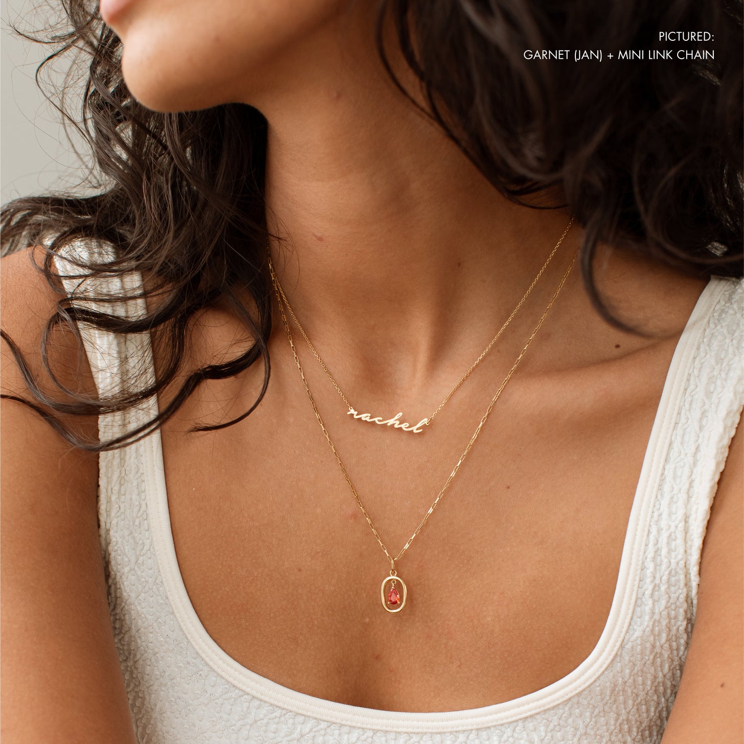 Garnet birthstone necklace with a mini link chain, layered with a cursive name necklace