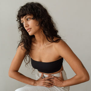 Model wearing spaced letters Lana Name Necklace