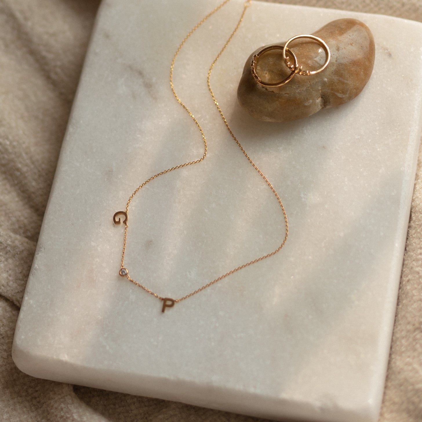 Two initials and a birthstone necklace. Show off your children's initials or partner's initials and their birthstone