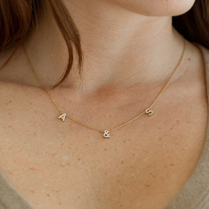 Dainty letters and numbers in cubic zirconia stones on a cable chain necklace