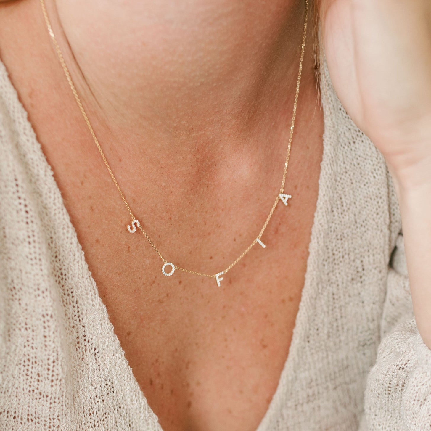 Model wearing Luciana Pave Name Necklace with spaced letters