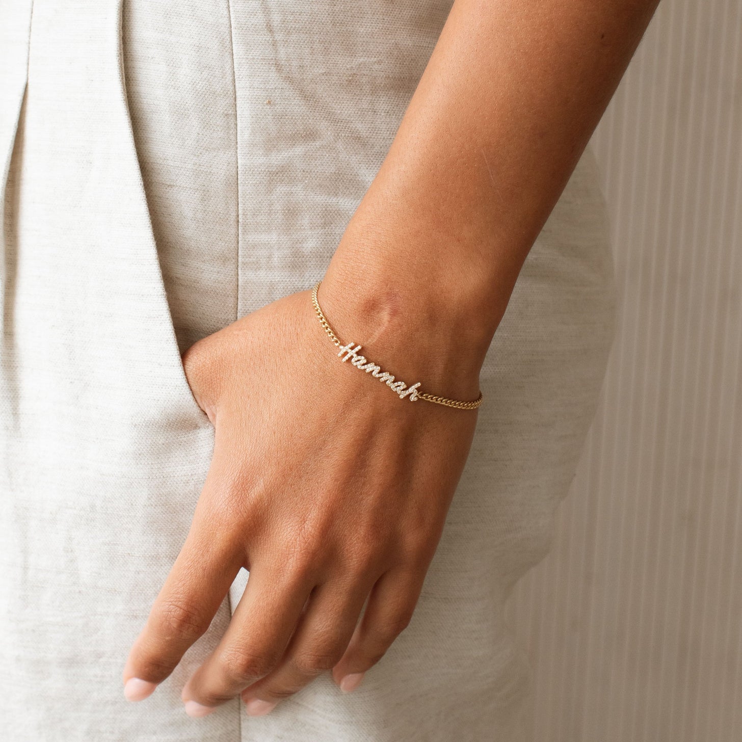 Model wearing Naia Pave Name Bracelet