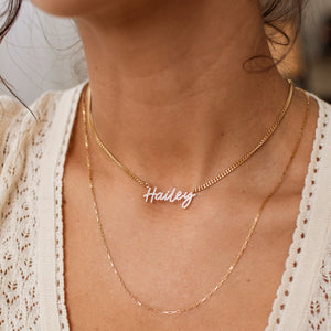 Gold custom Naia Pave Name Necklace paired with mini link chain necklace