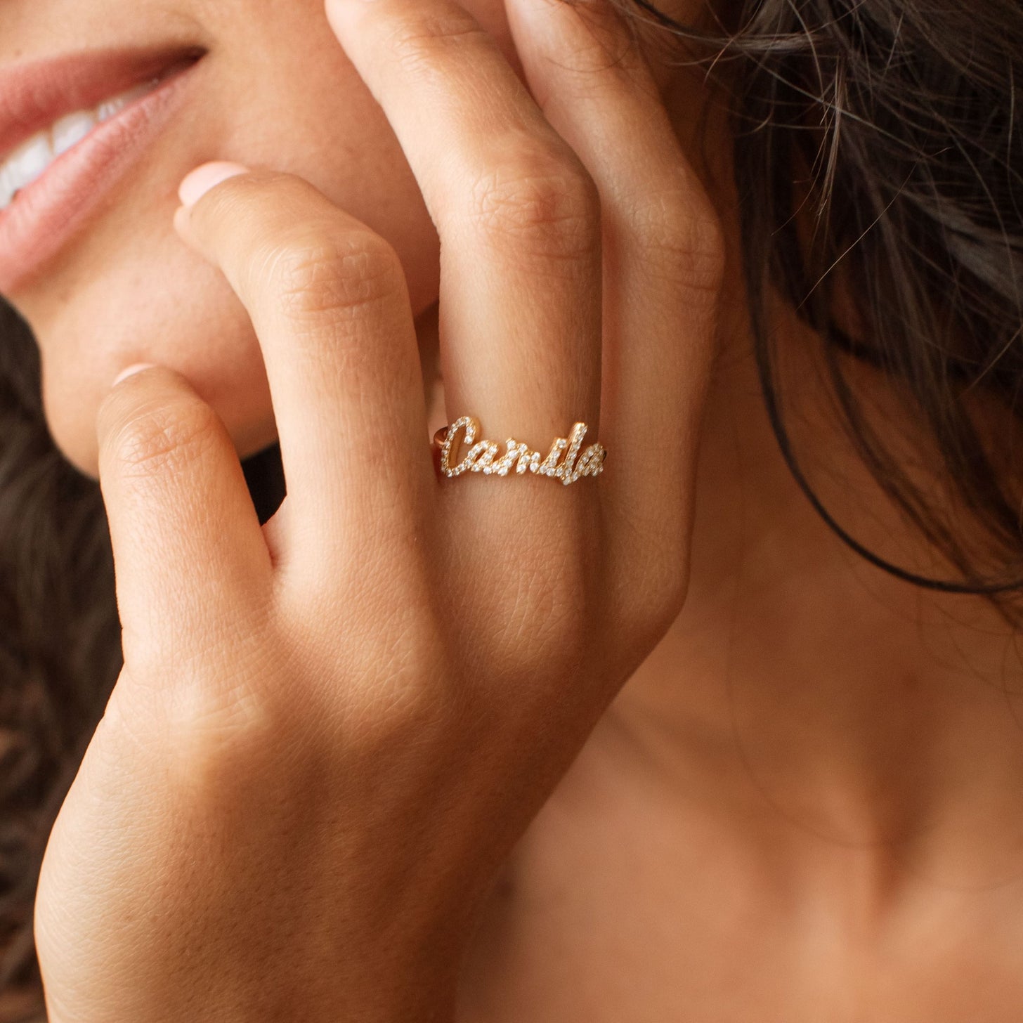 Gold name ring with pave stones on custom name letters