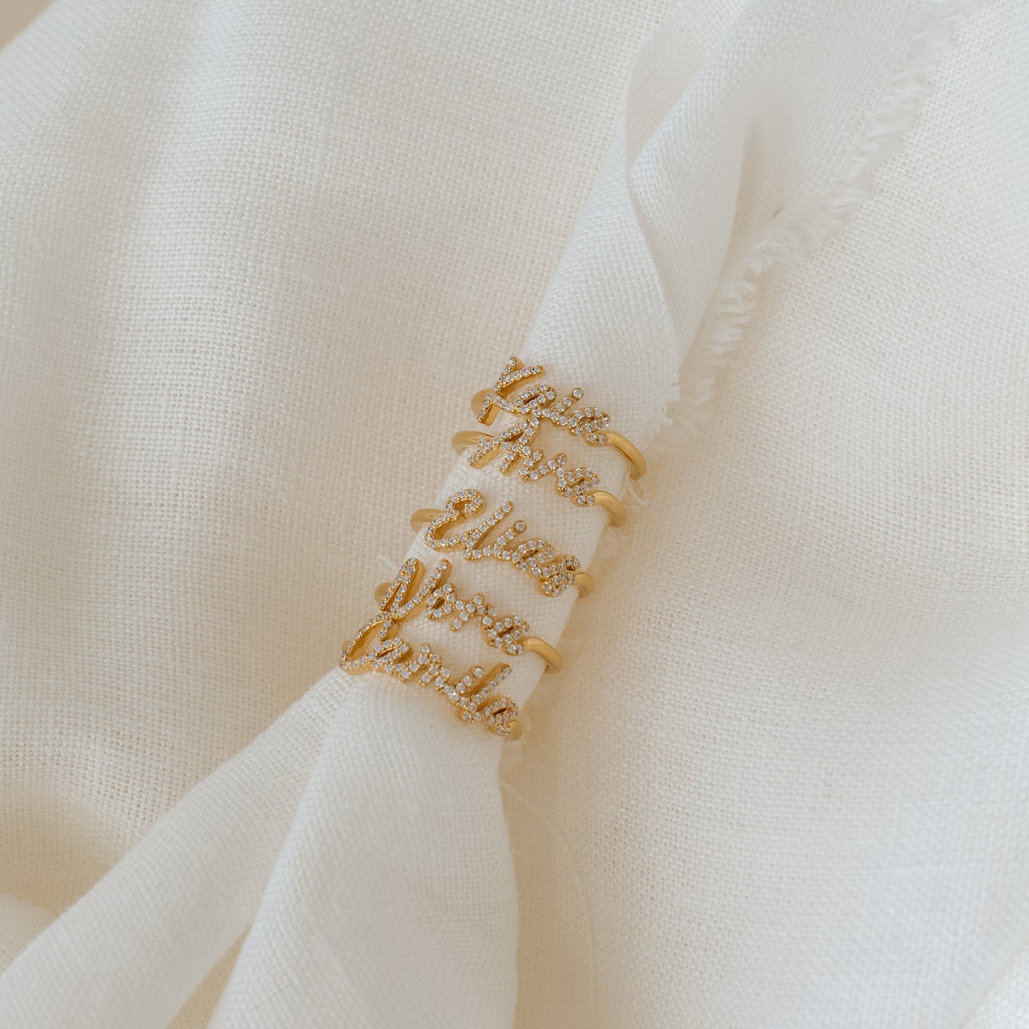 Examples of Naia Name Rings with pave letters