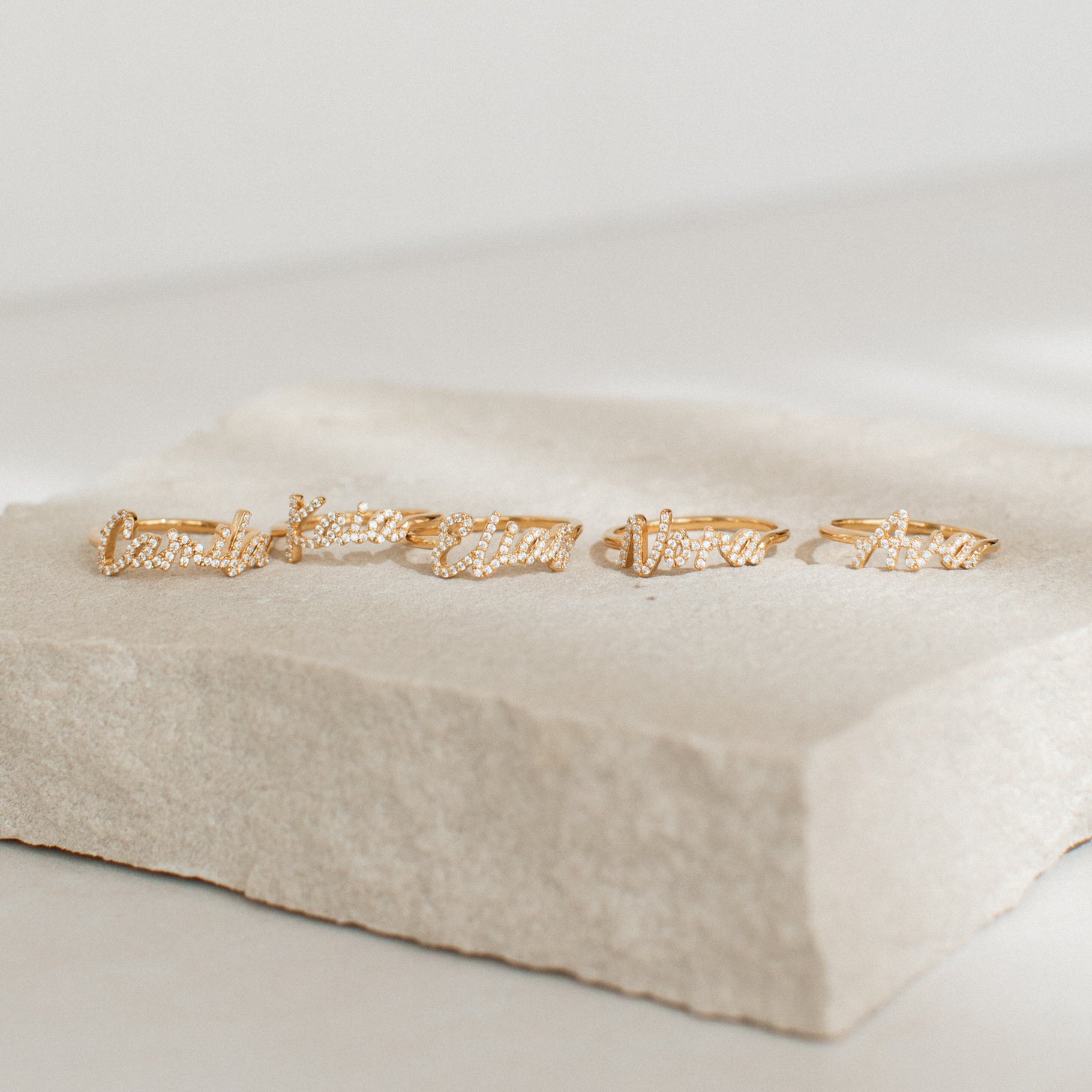 Examples of script name rings with pave cubic zirconia stones