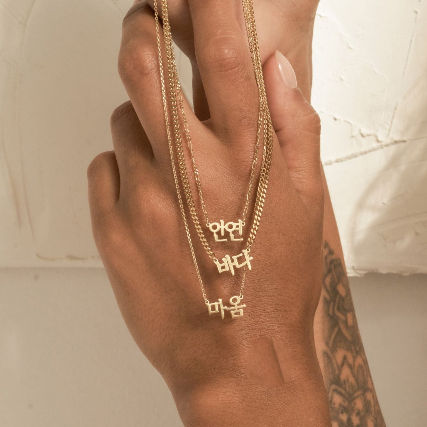 Korean Hangul name necklaces with a bold curb chain, cable chain, and figaro chain