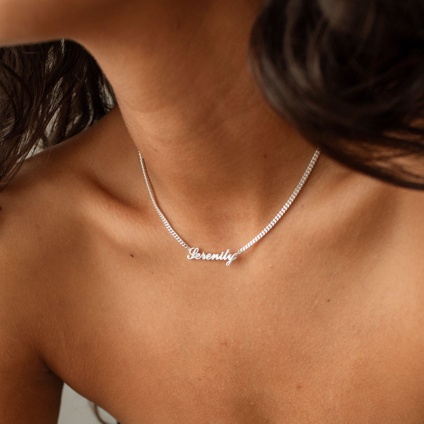 Model wearing silver Nariko Script Name Necklace