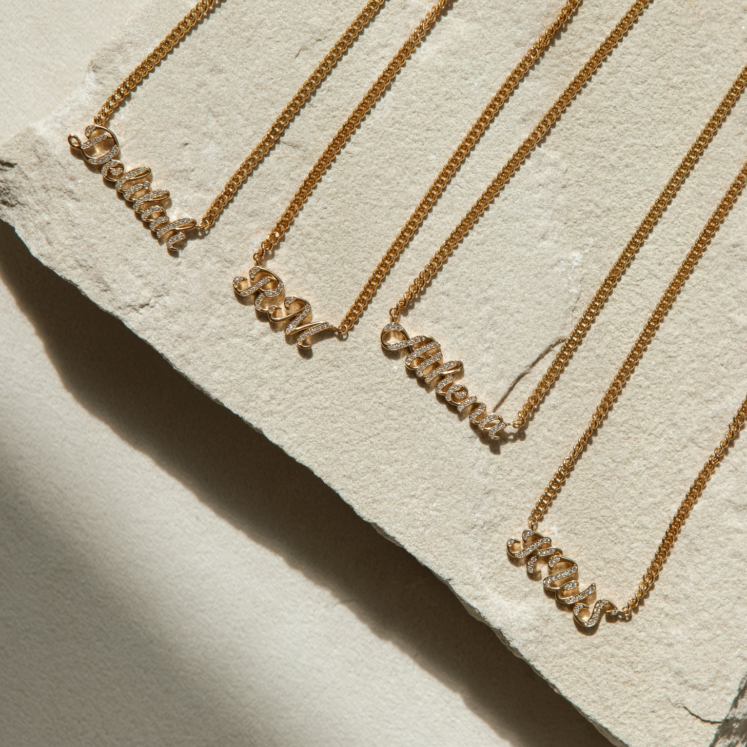 Name necklace, initial necklace, and number necklaces with personalized words and pave diamond letters. Available in gold, silver, and rose gold