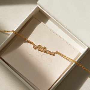 Custom name necklace in cursive font with diamond cubic zirconia letters. Personalize the necklace with a name, word, or number