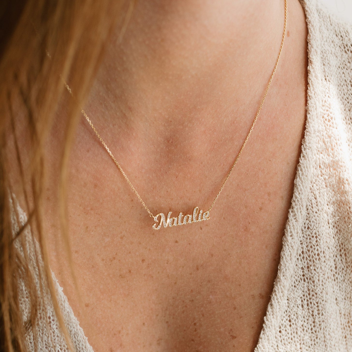 Gold custom name necklace with cubic zirconia stones on a dainty cable chain