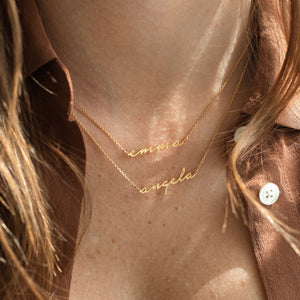 Custom gold script name necklace with romantic cursive font