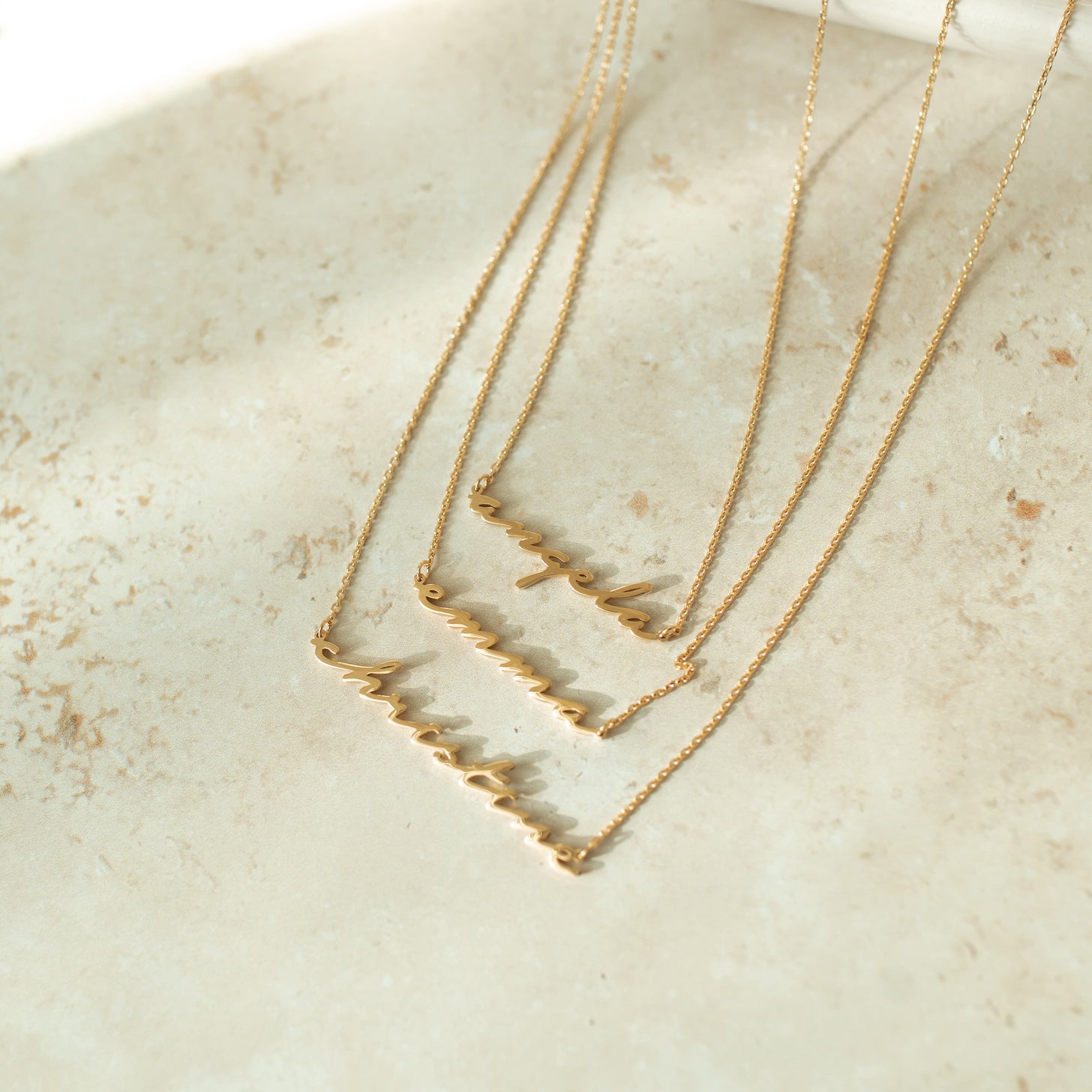 Custom nameplate necklace in elegant font on a dainty cable chain. Adjustable length, available in gold, silver, and rose gold