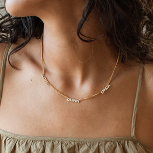 Model wearing 3-name Nita Pave Multiple Name Necklace