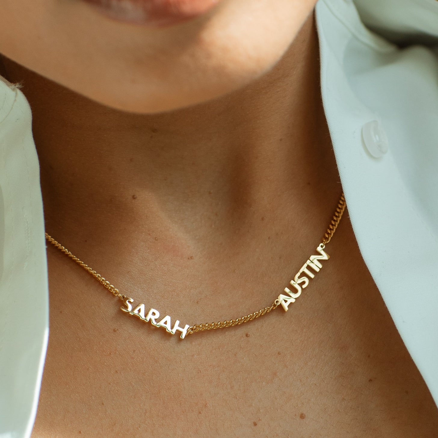Close-up of gold 2-name Noelle Multiple Name Necklace