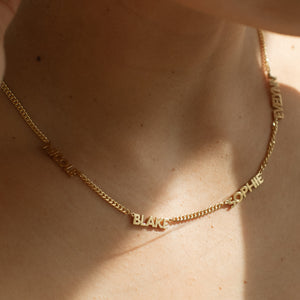 Close-up of gold 4-name Noelle Multiple Name Necklace