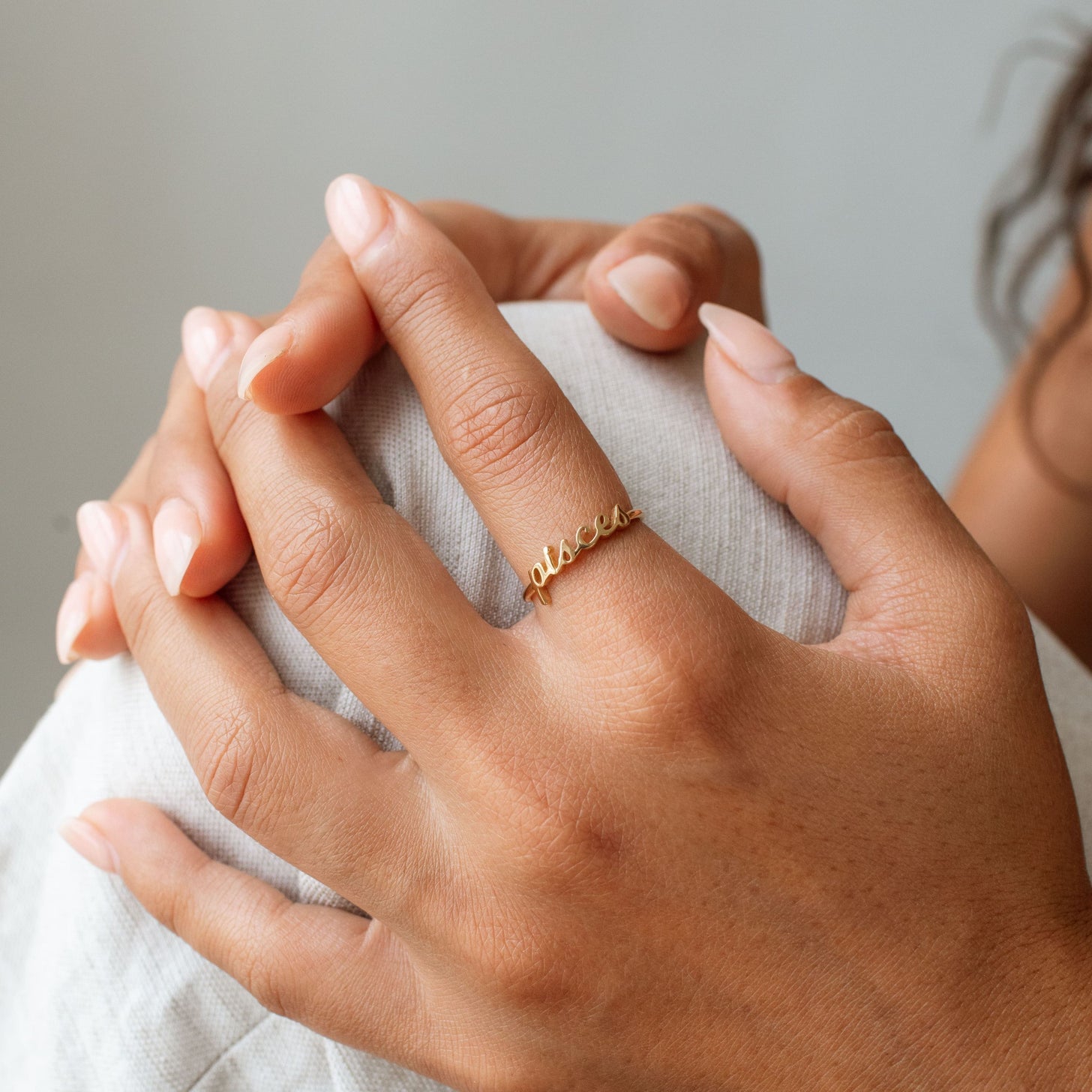 Gold custom word ring in cursive handwriting