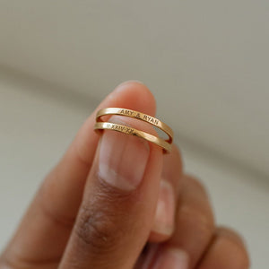 Gold custom engraved band rings with special names and Roman numerals