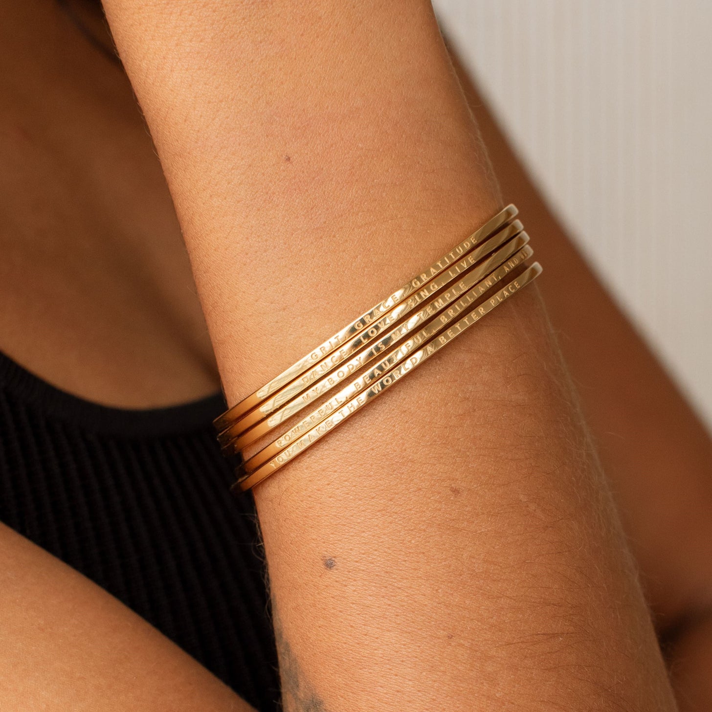 Stackable engraved cuff bracelets with a custom message