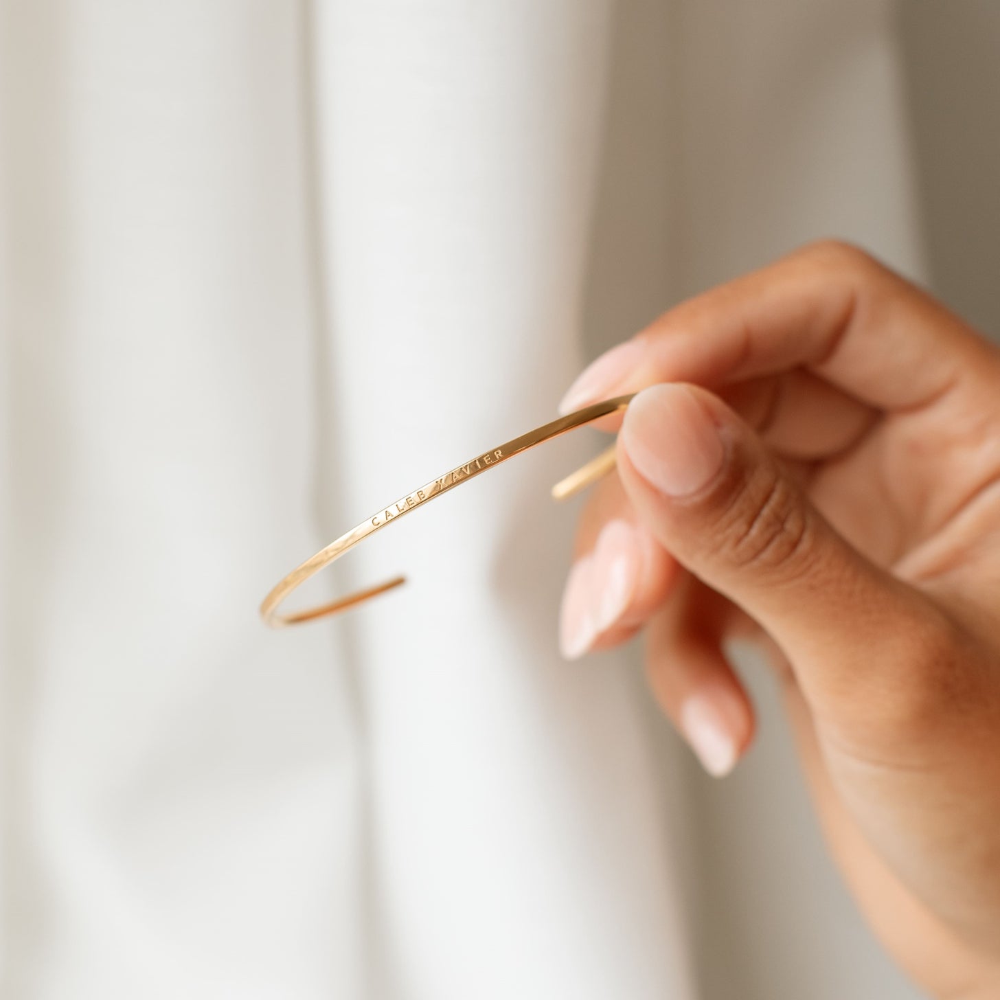 Front engraving of gold cuff bracelet