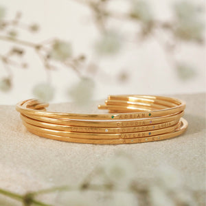 Gold stackable engraved cuffs with birthstones