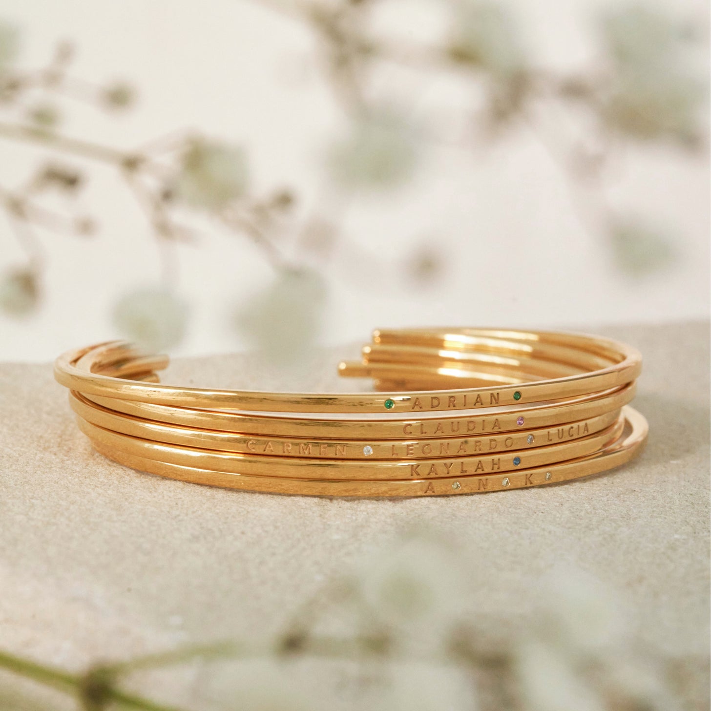 Gold stackable engraved cuffs with birthstones